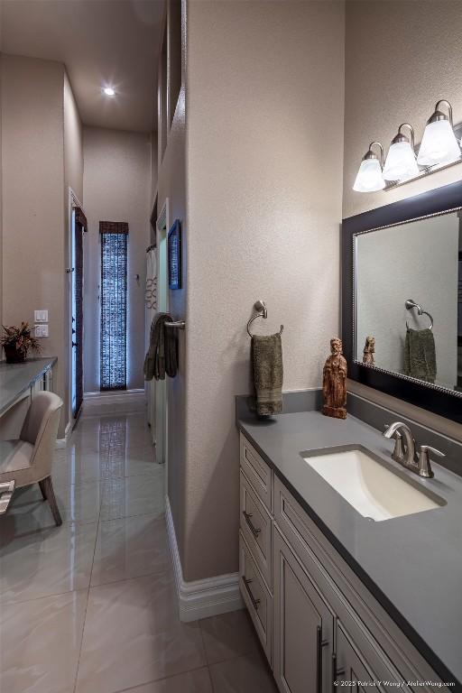 14305 Fallen Timber Dr, Austin, TX 78734 - bathroom featuring vanity and baseboards