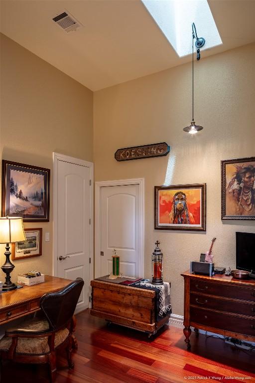 14305 Fallen Timber Dr, Austin, TX 78734 - home office featuring a skylight and wood finished floors
