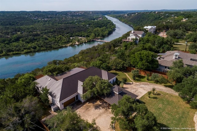 bird's eye view of a nearby body of water and a forest