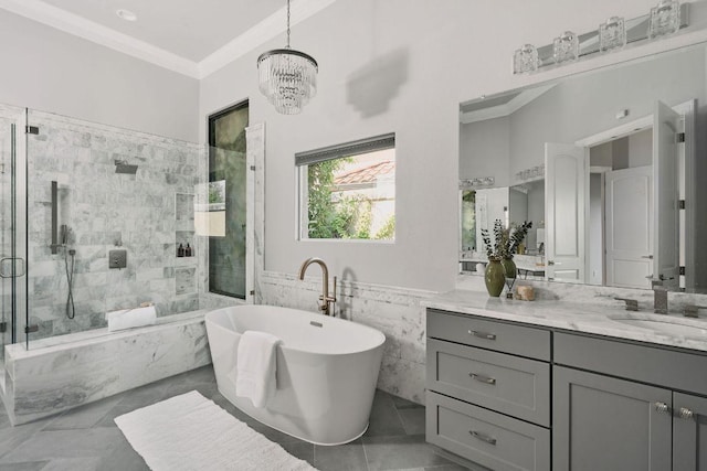 full bath featuring a shower stall, a freestanding tub, tile walls, ornamental molding, and vanity