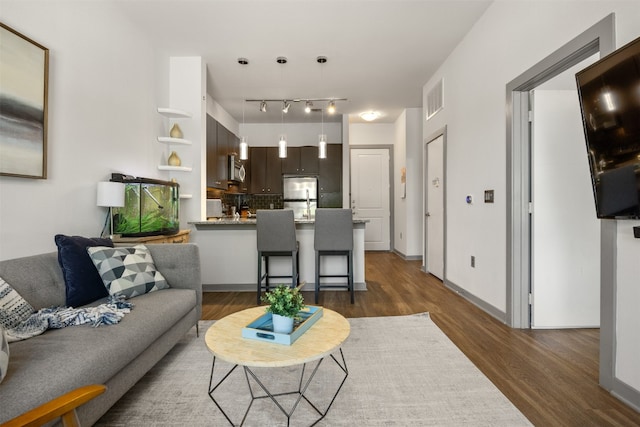 1900 Barton Springs Rd Unit 2023, Austin, TX 78704 - living area with dark wood finished floors and track lighting