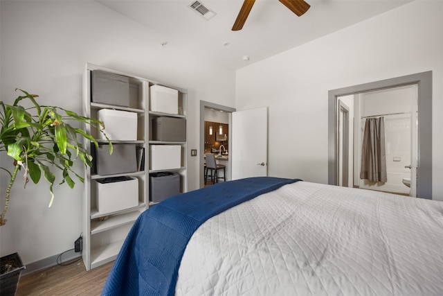 1900 Barton Springs Rd Unit 2023, Austin, TX 78704 - bedroom featuring wood finished floors and connected bathroom