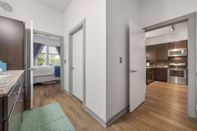 1900 Barton Springs Rd Unit 2023, Austin, TX 78704 - hall with light wood-style floors