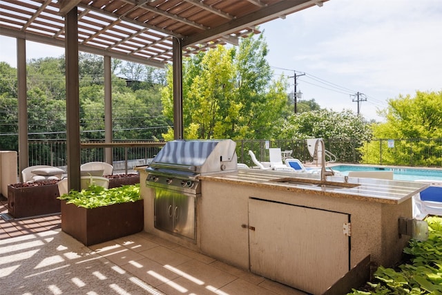 1900 Barton Springs Rd Unit 2023, Austin, TX 78704 - view of patio / terrace featuring exterior kitchen and a pergola