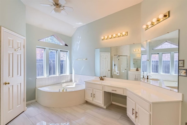 103 Savin Rise Ct, Pflugerville, TX 78660 - full bath with vanity, a garden tub, vaulted ceiling, a shower stall, and a ceiling fan