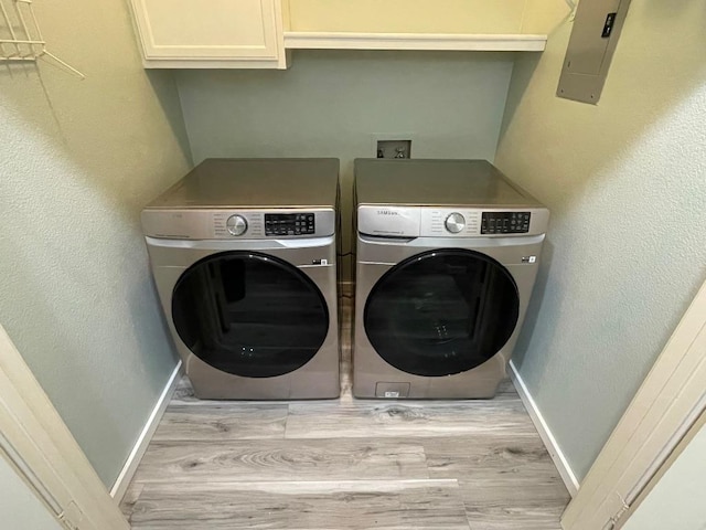 103 Savin Rise Ct, Pflugerville, TX 78660 - laundry area with cabinet space, independent washer and dryer, baseboards, and light wood-style floors