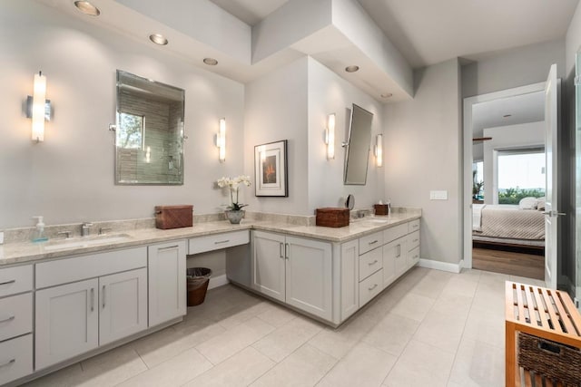 6605 W Courtyard Dr, Austin, TX 78730 - bathroom with vanity, tile patterned flooring, baseboards, ensuite bathroom, and recessed lighting