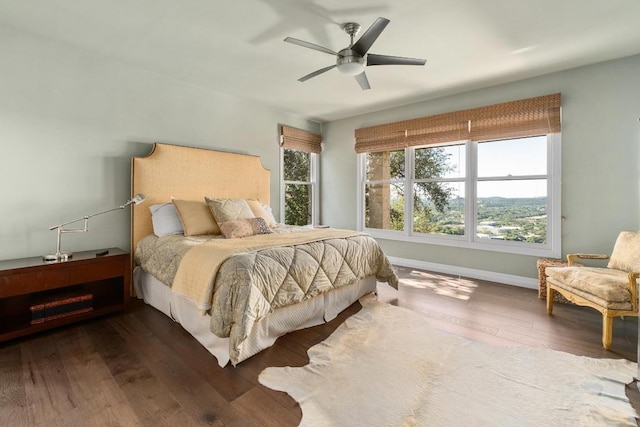 6605 W Courtyard Dr, Austin, TX 78730 - bedroom featuring wood-type flooring and ceiling fan