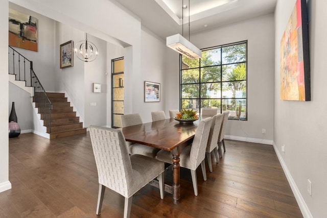 6605 W Courtyard Dr, Austin, TX 78730 - dining space featuring dark wood finished floors, stairway, a chandelier, and baseboards