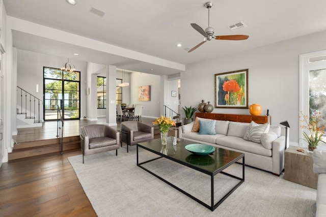 6605 W Courtyard Dr, Austin, TX 78730 - living room featuring healthy amount of natural light, stairs, wood finished floors, baseboards, and recessed lighting