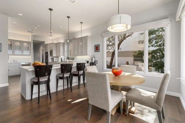 6605 W Courtyard Dr, Austin, TX 78730 - dining area with dark wood-style floors, recessed lighting, and baseboards