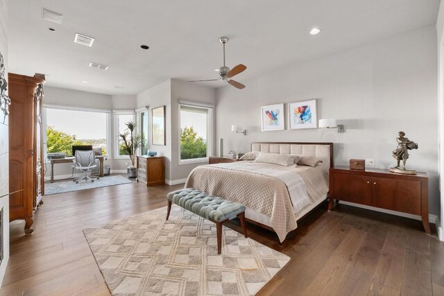 6605 W Courtyard Dr, Austin, TX 78730 - bedroom featuring wood finished floors, multiple windows, recessed lighting, and ceiling fan