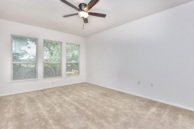 221 Bonham Loop, Georgetown, TX 78633 - spare room with a ceiling fan, light carpet, and baseboards