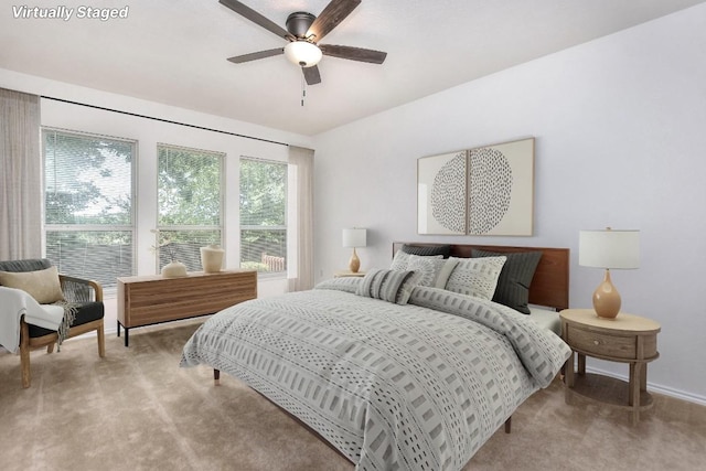 221 Bonham Loop, Georgetown, TX 78633 - bedroom with light carpet, a ceiling fan, and baseboards