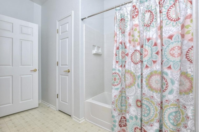 221 Bonham Loop, Georgetown, TX 78633 - full bath with tile patterned floors, shower / bathtub combination with curtain, and baseboards