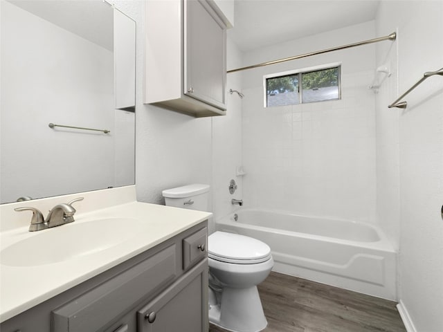 10719 Watchful Fox Dr, Austin, TX 78748 - full bath with toilet, wood finished floors, vanity, and bathing tub / shower combination