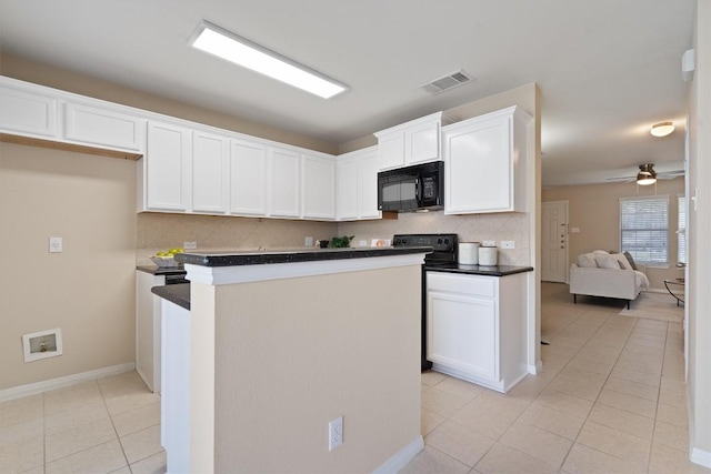 401 Buttercup Creek Blvd Unit 1005, Cedar Park, TX 78613 - kitchen with black microwave, light tile patterned floors, a center island, white cabinets, and tasteful backsplash