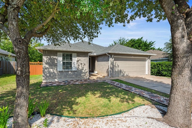 118 Cassandra Dr, Hutto, TX 78634 - ranch-style house featuring a garage, driveway, brick siding, and roof with shingles