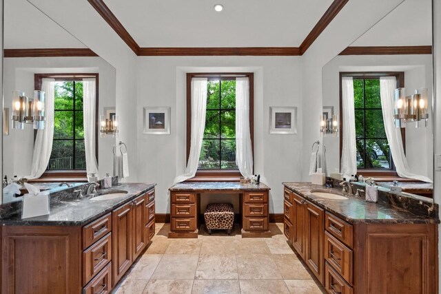 12724 Little Blue Stem Cv, Austin, TX 78738 - bathroom featuring baseboards, plenty of natural light, two vanities, and ornamental molding