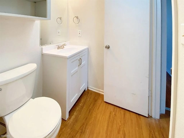 1604 Mill St Unit B, San Marcos, TX 78666 - half bath featuring wood finished floors, vanity, and toilet