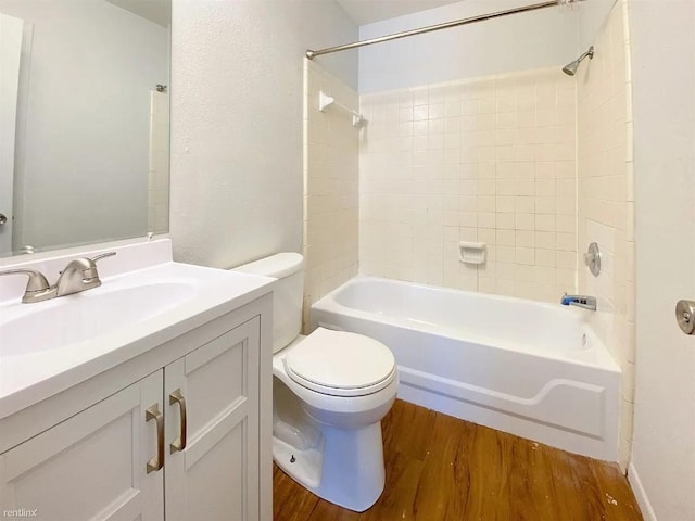 1604 Mill St Unit B, San Marcos, TX 78666 - bathroom with wood finished floors, bathtub / shower combination, and vanity