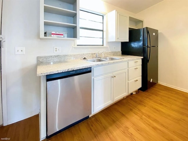 1604 Mill St Unit B, San Marcos, TX 78666 - kitchen featuring dishwasher, a sink, freestanding refrigerator, and open shelves