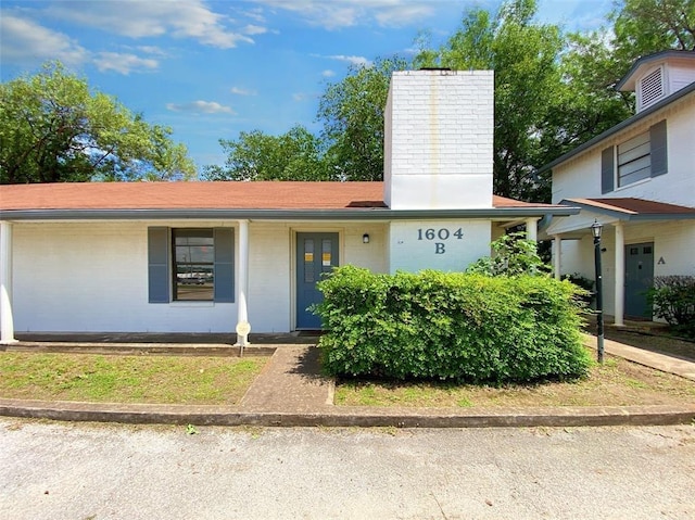 1604 Mill St Unit B, San Marcos, TX 78666 - view of front of property with a chimney and covered porch