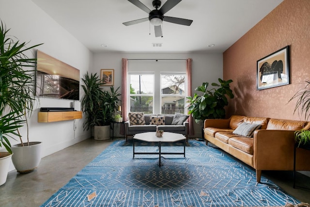 2912 Govalle Ave Unit A, Austin, TX 78702 - living room featuring concrete flooring, a ceiling fan, and a textured wall