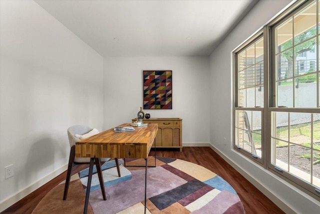 office area featuring baseboards and dark wood-style flooring