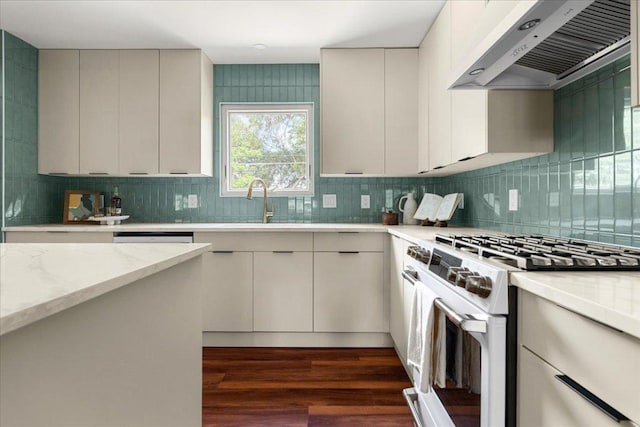 3605 Tallison Ter, Austin, TX 78704 - kitchen featuring white gas stove, exhaust hood, backsplash, and dark wood finished floors
