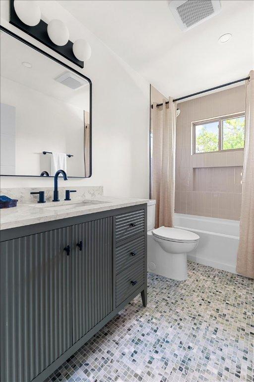 3605 Tallison Ter, Austin, TX 78704 - full bathroom featuring shower / bath combination with curtain, vanity, and tile patterned flooring