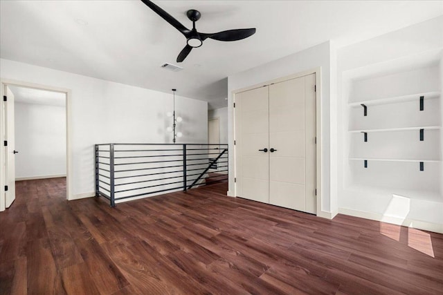 3605 Tallison Ter, Austin, TX 78704 - empty room with a ceiling fan, wood finished floors, and built in shelves