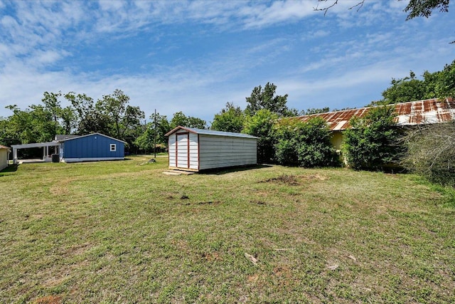710 E 2nd St, Elgin, TX 78621 - view of green lawn with a shed