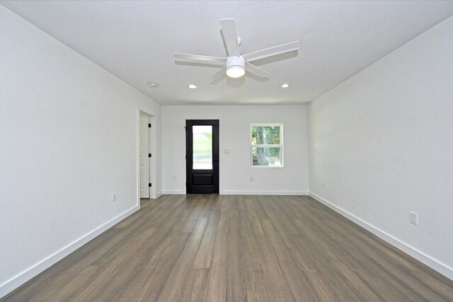 710 E 2nd St, Elgin, TX 78621 - unfurnished room with dark wood finished floors, ceiling fan, and recessed lighting