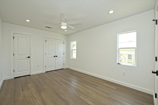 710 E 2nd St, Elgin, TX 78621 - unfurnished bedroom with dark wood-style floors, recessed lighting, and ceiling fan
