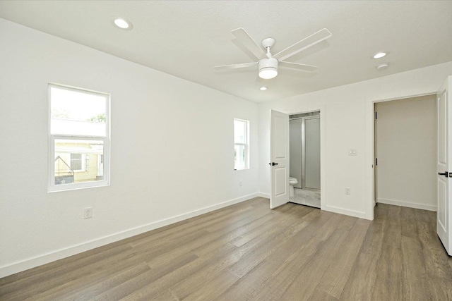 710 E 2nd St, Elgin, TX 78621 - unfurnished bedroom with light wood-style floors, recessed lighting, and a ceiling fan