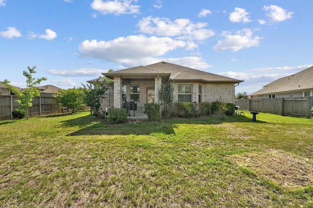 110 N Sage Holw, Dripping Springs, TX 78620 - back of property with a patio and brick siding