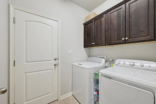 110 N Sage Holw, Dripping Springs, TX 78620 - laundry area with cabinet space, washing machine and clothes dryer, and light tile patterned flooring