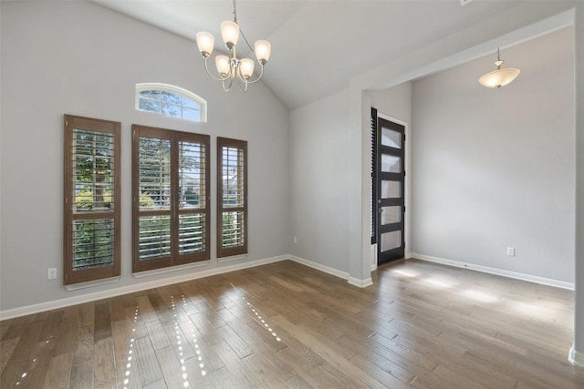 110 N Sage Holw, Dripping Springs, TX 78620 - unfurnished room featuring a chandelier, hardwood / wood-style floors, and high vaulted ceiling