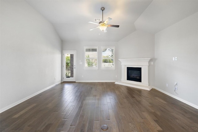 110 N Sage Holw, Dripping Springs, TX 78620 - unfurnished living room with lofted ceiling, a ceiling fan, a glass covered fireplace, and dark wood finished floors