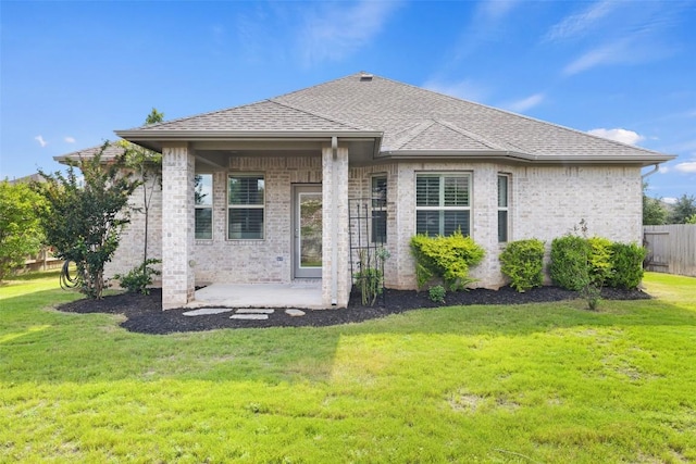 110 N Sage Holw, Dripping Springs, TX 78620 - rear view of property featuring a patio, brick siding, and a shingled roof