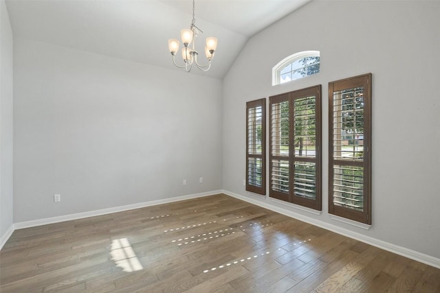 110 N Sage Holw, Dripping Springs, TX 78620 - spare room with a chandelier, wood finished floors, and high vaulted ceiling