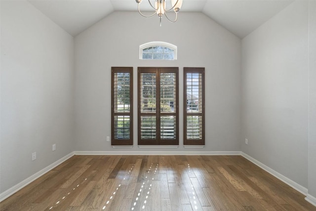 110 N Sage Holw, Dripping Springs, TX 78620 - unfurnished room with a chandelier, wood finished floors, and vaulted ceiling