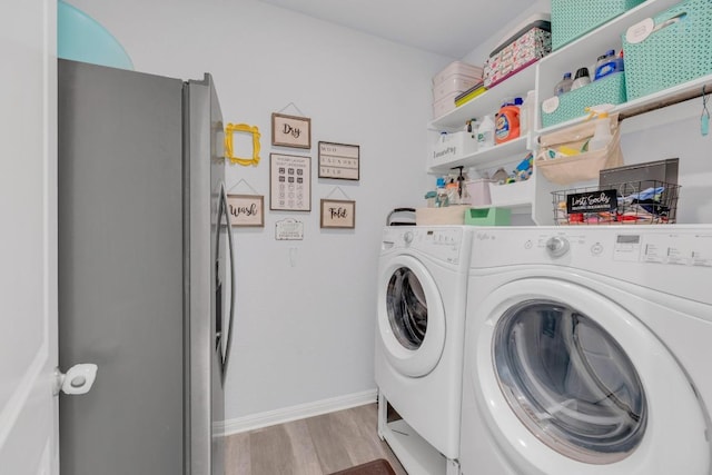 200 Waterway Ave, Hutto, TX 78634 - laundry area with independent washer and dryer and wood finished floors