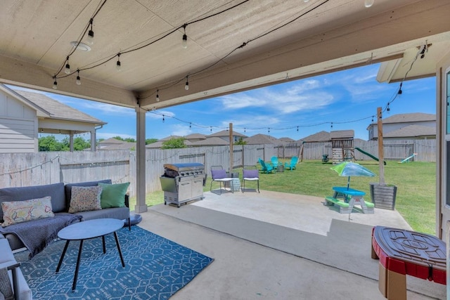 200 Waterway Ave, Hutto, TX 78634 - fenced backyard with a playground, a patio, outdoor lounge area, and area for grilling