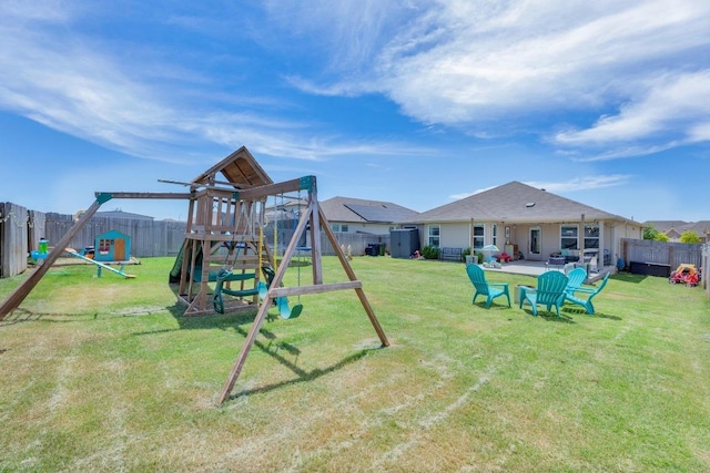 200 Waterway Ave, Hutto, TX 78634 - fenced backyard featuring a playground and a patio