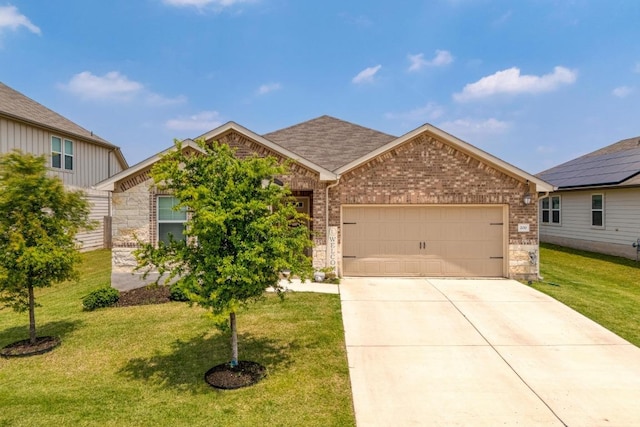 200 Waterway Ave, Hutto, TX 78634 - view of front facade with an attached garage, brick siding, a front lawn, driveway, and stone siding