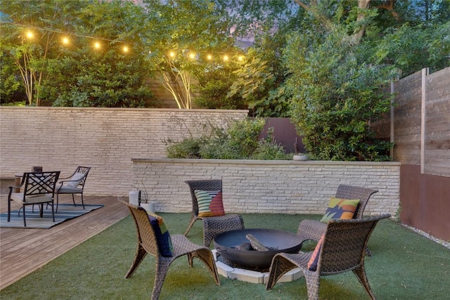 2901 S 5th St, Austin, TX 78704 - fenced backyard featuring a wooden deck and an outdoor fire pit