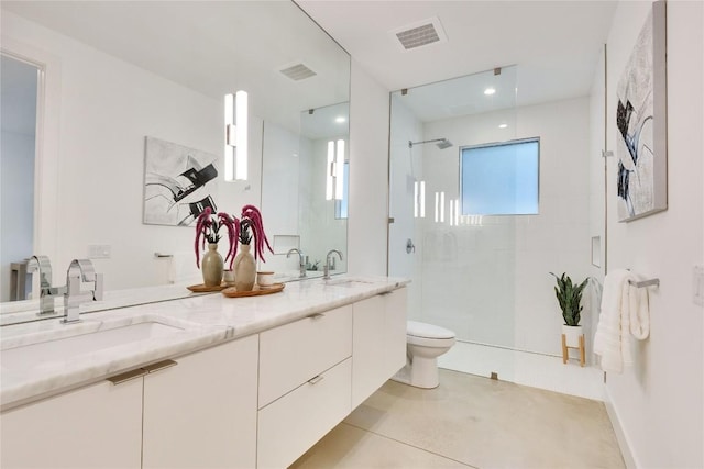 2901 S 5th St, Austin, TX 78704 - full bathroom featuring toilet, walk in shower, and double vanity