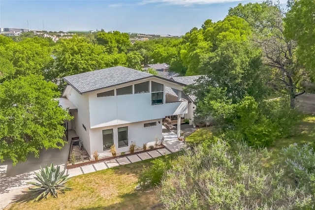 2502 Side Cv, Austin, TX 78704 - back of property with stucco siding and a shingled roof